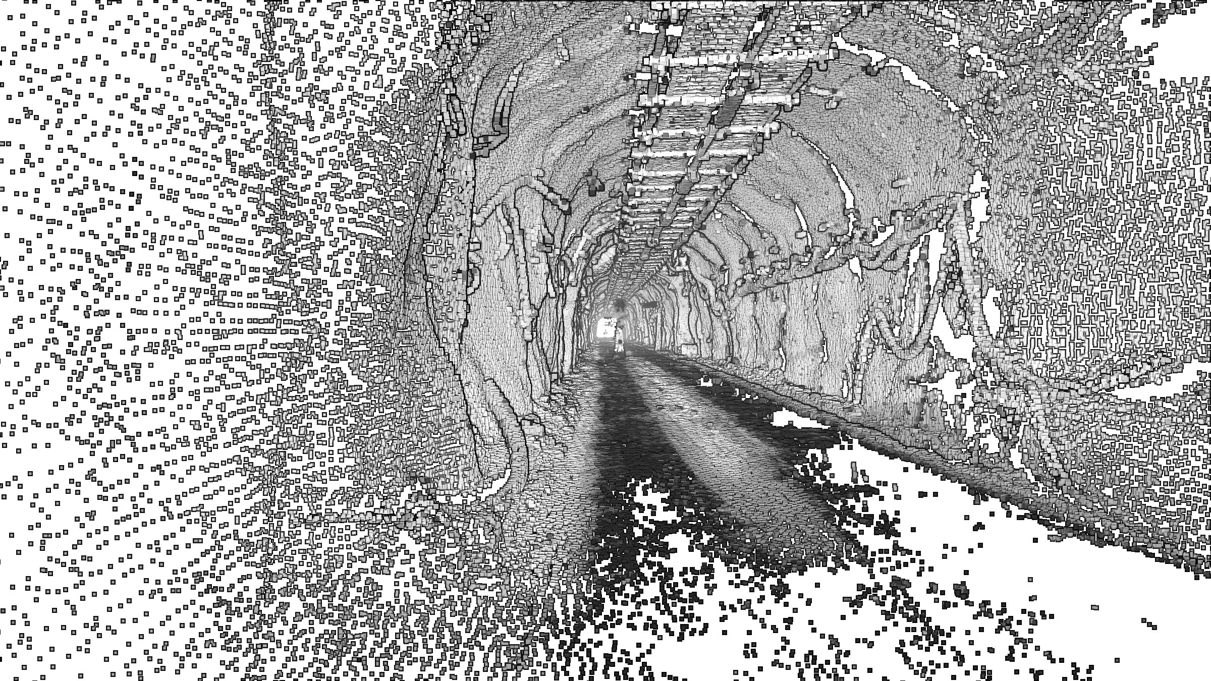 Inside a production drift at El Teniente: the fused laser model, rock bolts and services along the roof, white where no scan measured